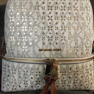 Michael Kors Vanilla Back Pack with multiple pockets and Storage space very Cute